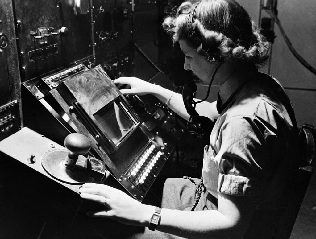 WAAF radar operator Denise Miley plotting aircraft on a cathode ray tube at Bawdsey Chain Home station