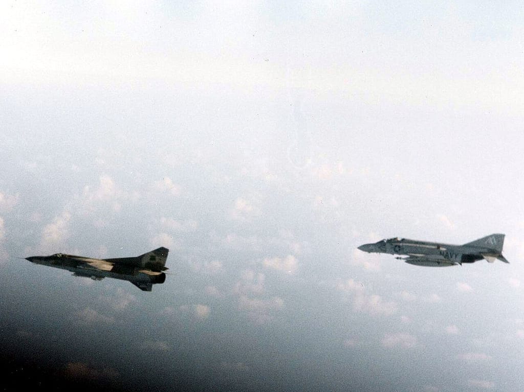 US Navy F-4J Phantom of VF-74 escorting a Libyan MiG-23 over the Gulf of Sidra in 1981