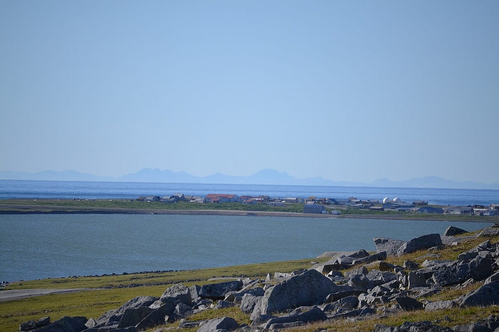 Gambell, Alaska, with the mountains of Chukotka visible across the Bering Sea