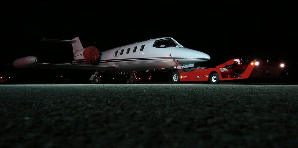 A Learjet 35 business jet parked on an airport ramp
