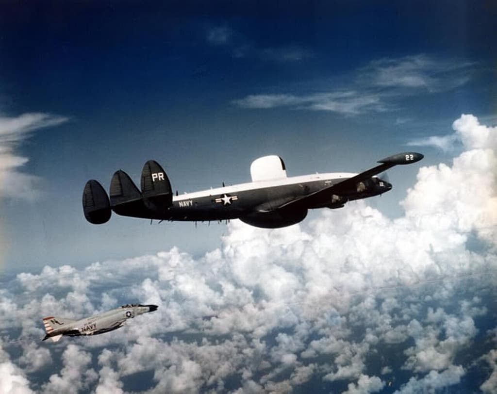 US Navy VQ-1 EC-121M Warning Star in flight with an F-4B escort