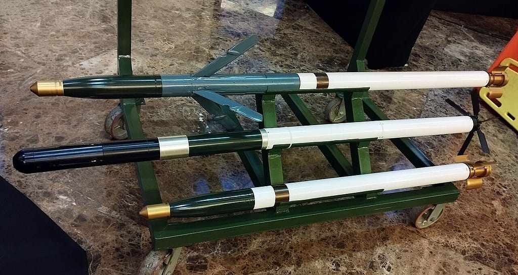 APKWS II guidance section full-scale mockup alongside a standard 70mm rocket