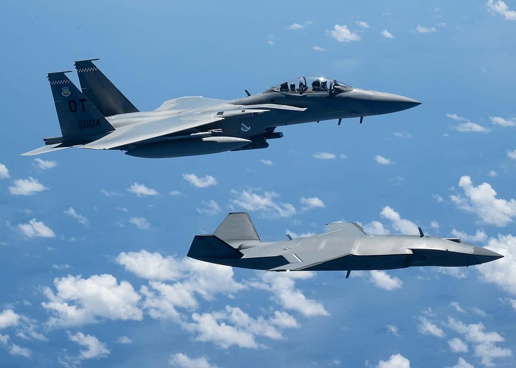 Boeing MQ-28 Ghost Bat flying alongside a USAF F-15EX during Valiant Shield 2026