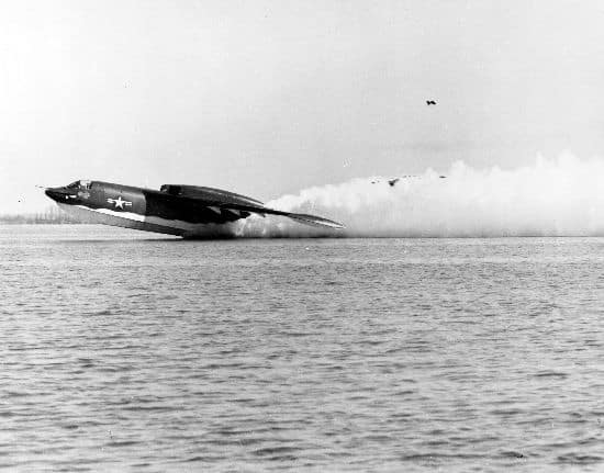 P6M SeaMaster taking off amid spray
