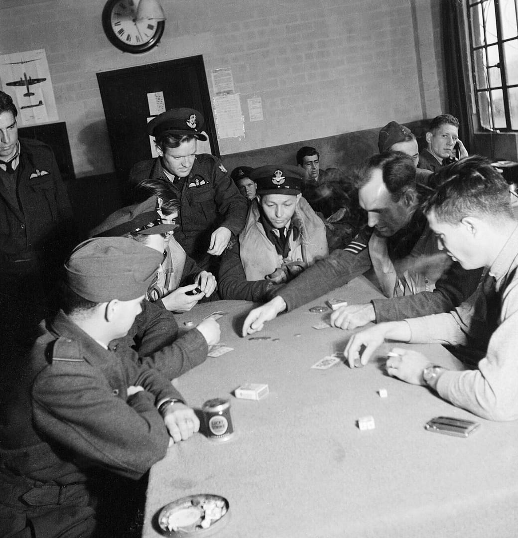 American volunteer pilots of No.121 (Eagle) Squadron playing poker in the dispersal hut at RAF Rochford in Essex during August 1942. D9514.jpg