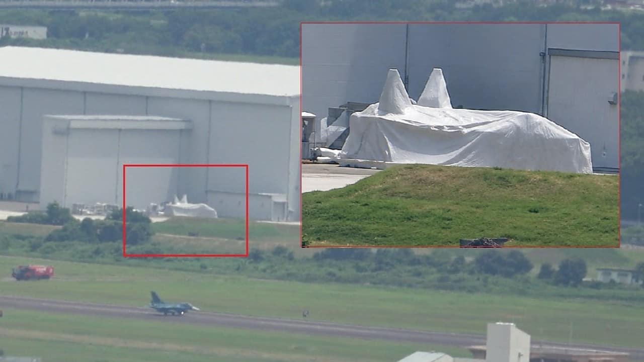 White-fabric-covered twin-tailed aircraft photographed at Japan Gifu Air Base