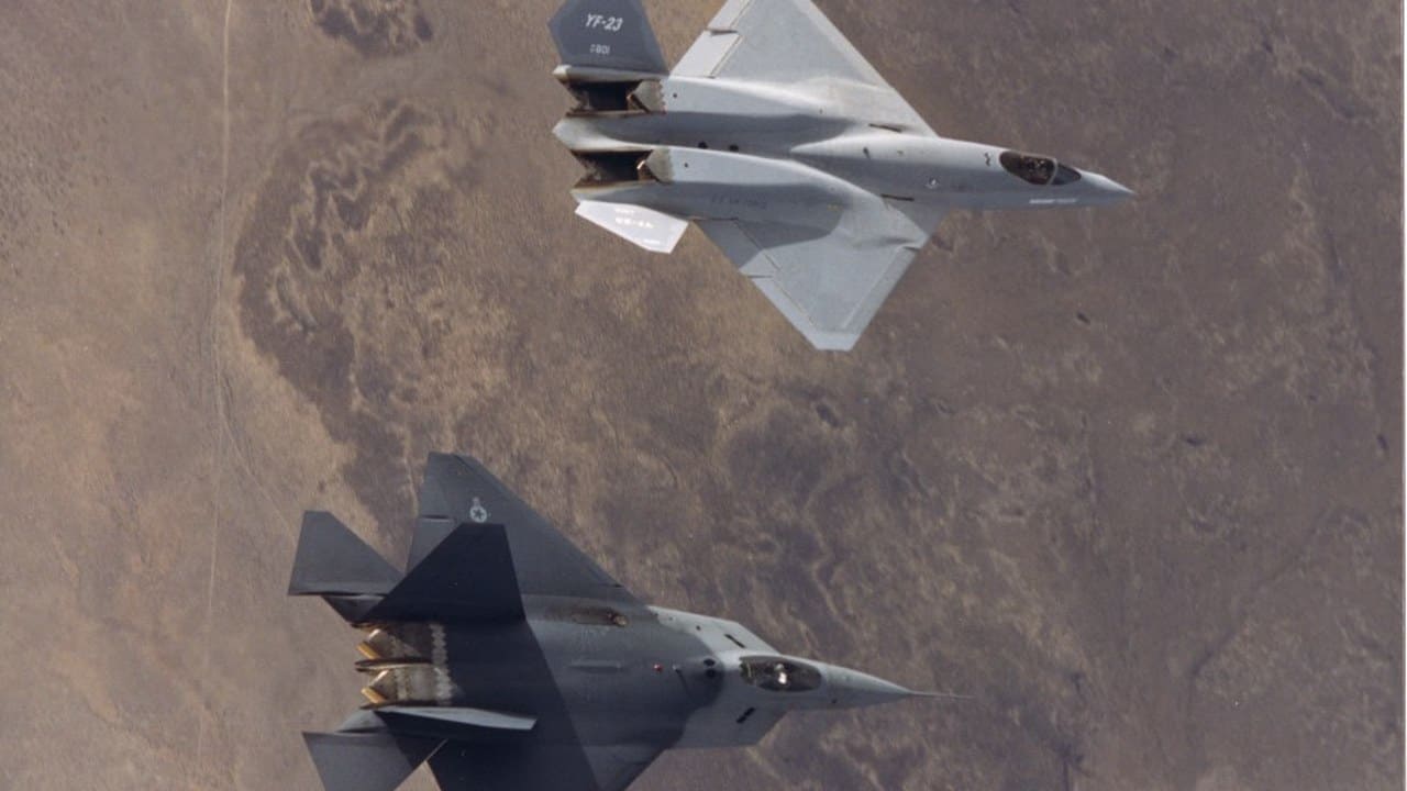 The two Northrop YF-23 prototypes in formation over the Mojave Desert during the ATF competition