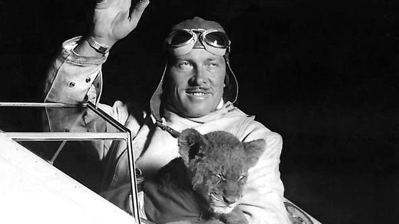 Roscoe Turner with Gilmore the lion cub Roscoe Turner waving from the cockpit while holding Gilmore the lion cub