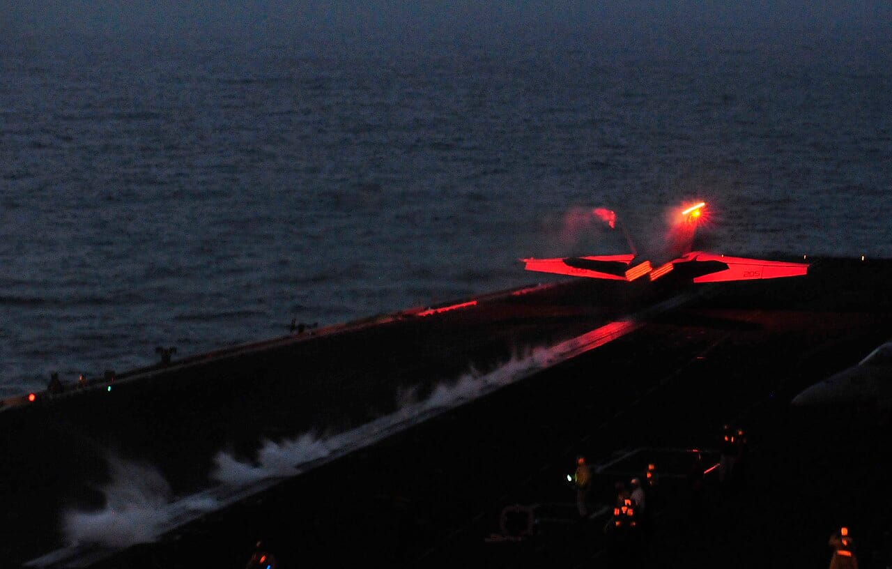 F/A-18F Super Hornet launches from a carrier during night operations