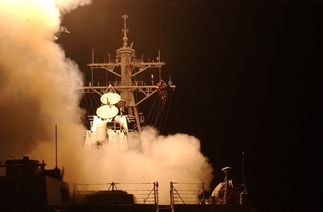 Tomahawk Land Attack Missiles launching from a US Navy destroyer