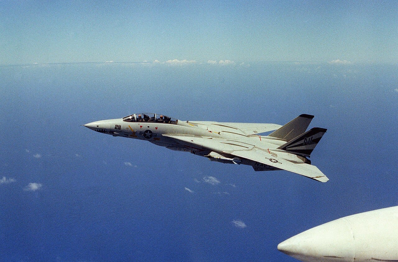 A Grumman F-14 Tomcat with its variable-sweep wings folded back for high speed