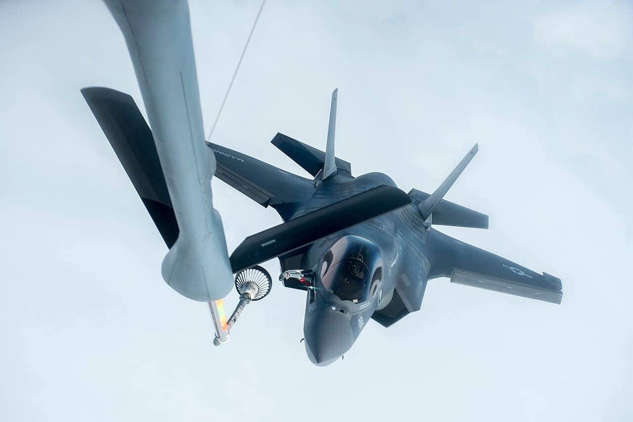 F-35A Lightning II stealth fighter jet being refueled mid-air over the Pacific Ocean