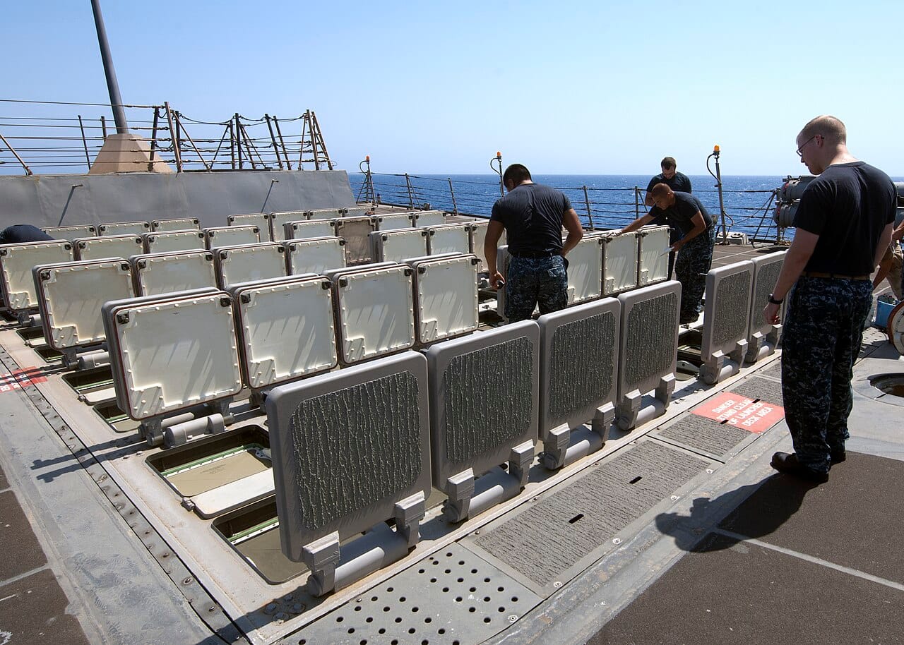 US Navy sailors maintaining Tomahawk cruise missile launchers aboard a warship