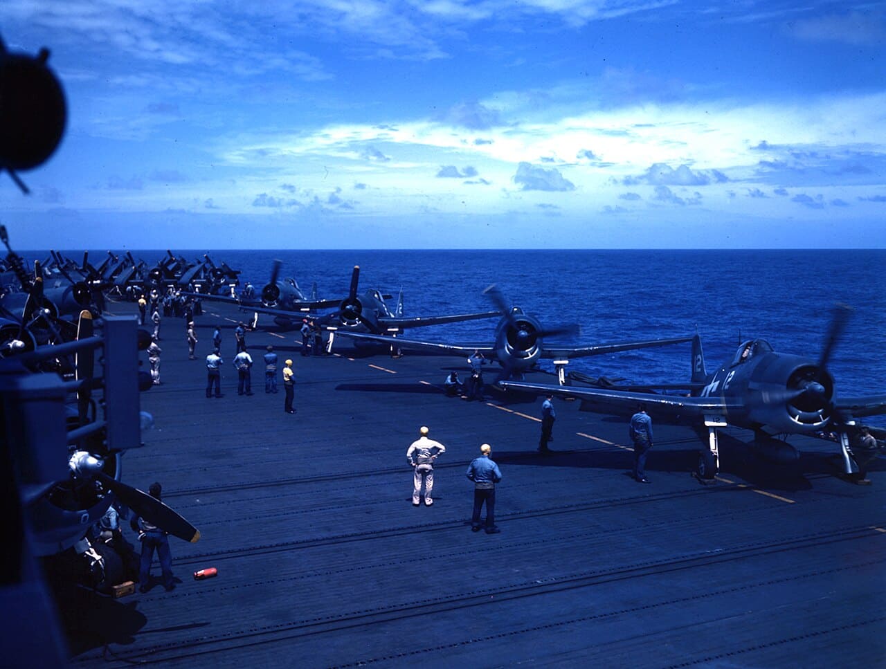 Grumman F6F Hellcats warming up on the flight deck of USS Cowpens, January 1944