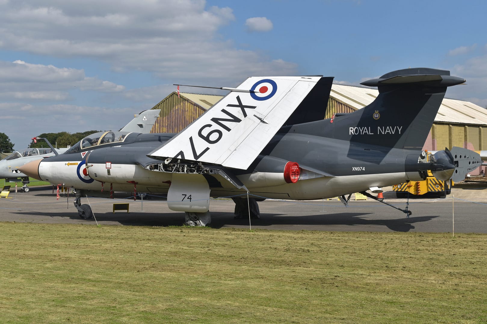 A Royal Navy Blackburn Buccaneer S.2 (XN974) with wings folded, showing the low-level strike aircraft in full side view