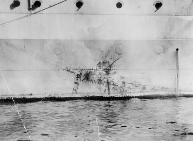 The imprint left by a Mitsubishi Ki-51 kamikaze on the hull of HMS Sussex, 1945