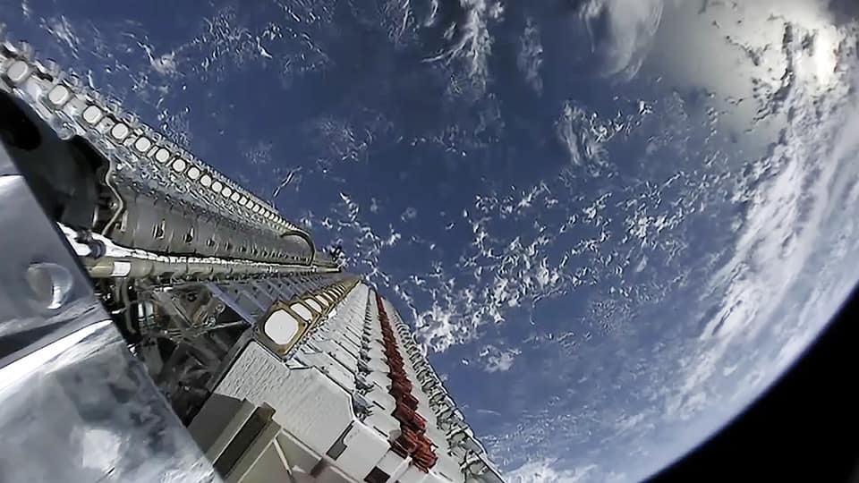 Passenger using in-flight Wi-Fi on an airliner via Starlink