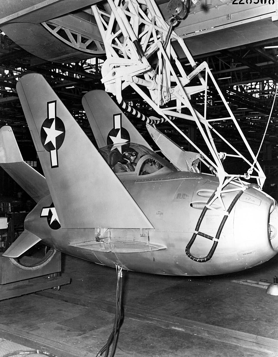 XF-85 Goblin on the trapeze hook beneath the EB-29 mothership