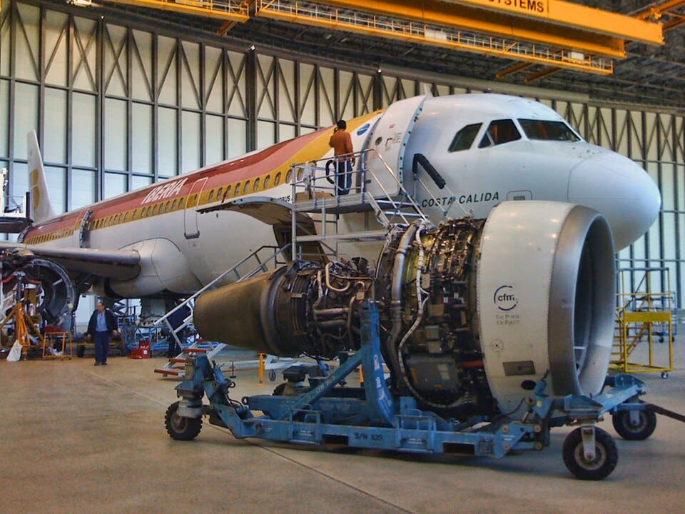 Aircraft undergoing heavy maintenance in hangar