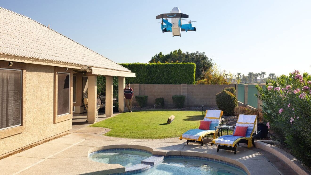 An Amazon Prime Air MK30 drone descending over a residential back garden