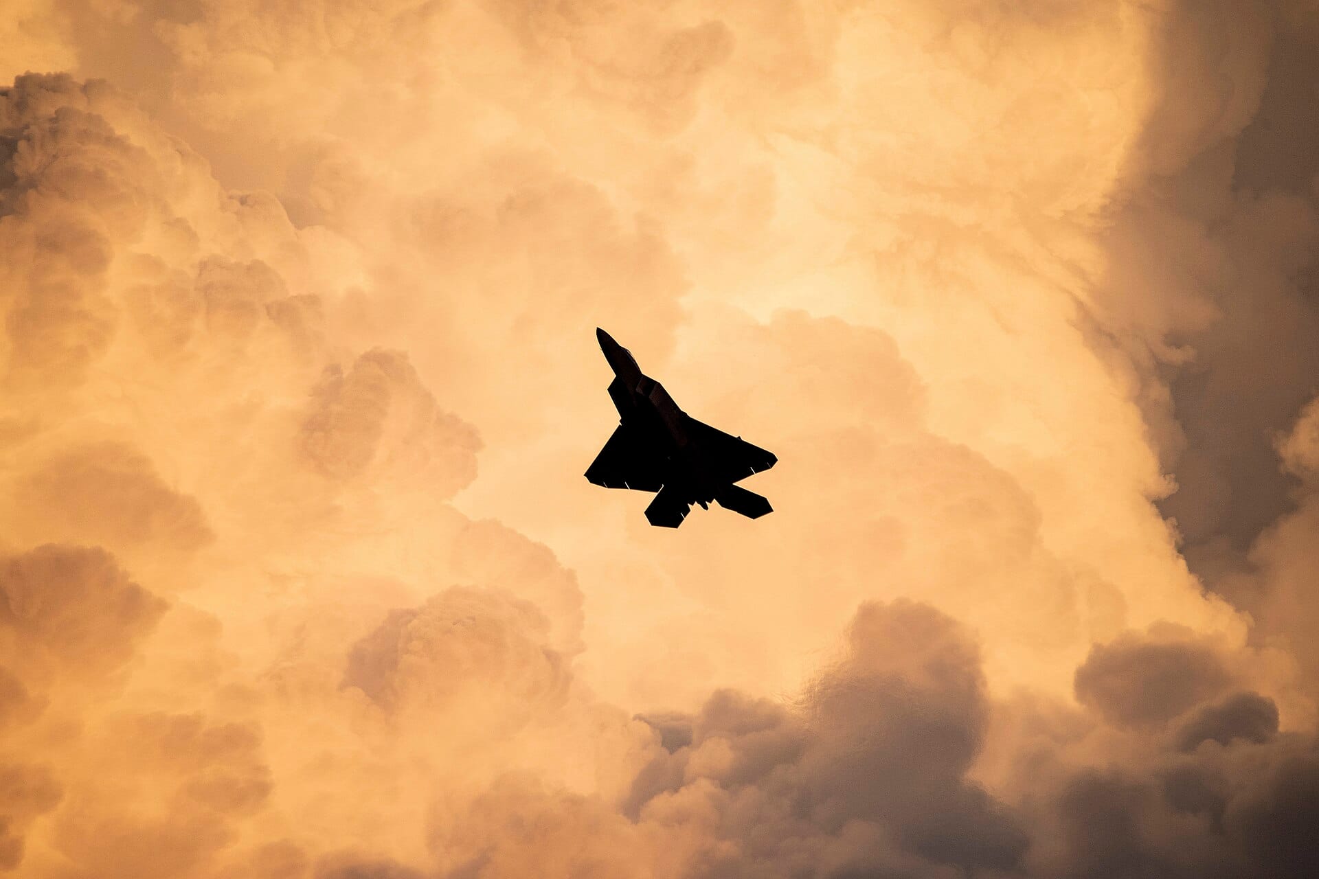 An F-22 Raptor stealth fighter at twilight