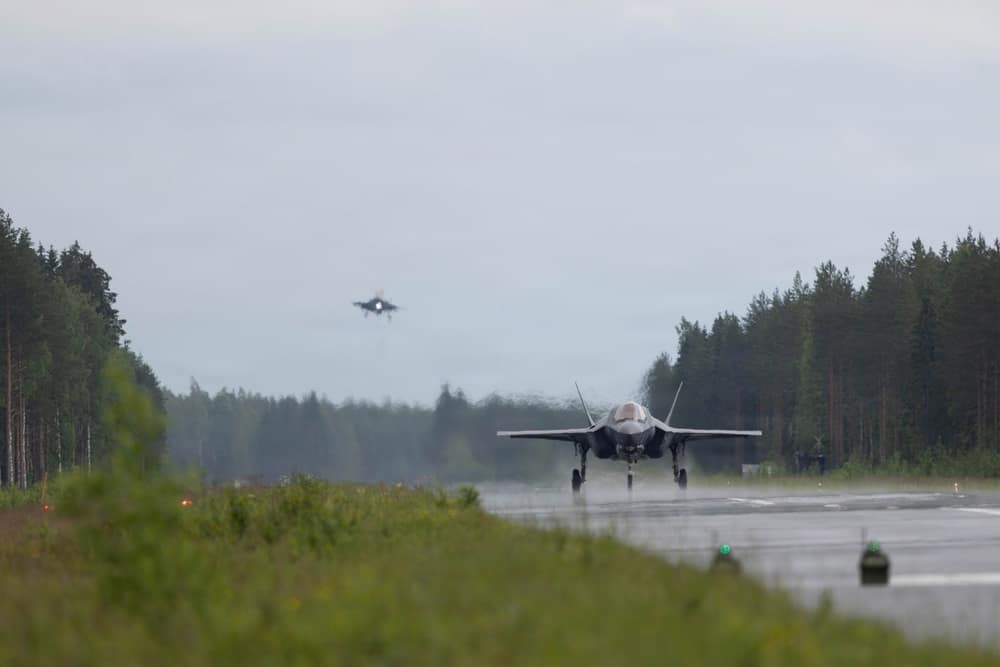 USMC F-35B on the Tervo highway strip as another lands