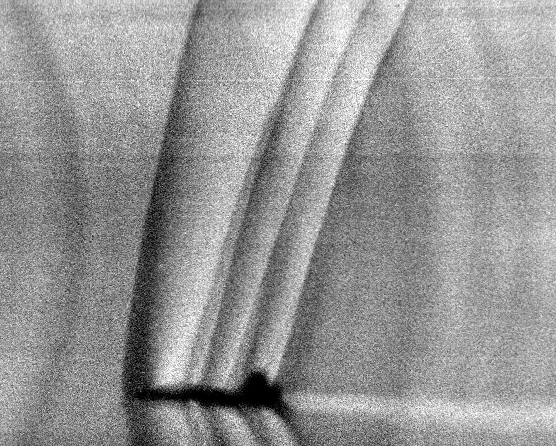 Schlieren photograph showing shock waves around a T-38 Talon model in a supersonic wind tunnel