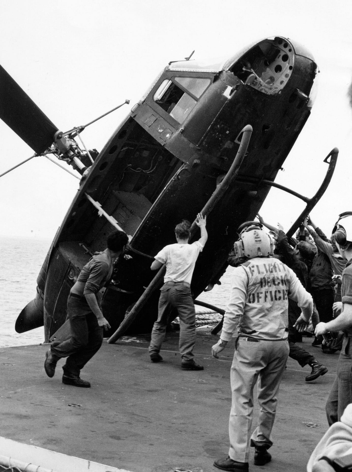 South Vietnamese Huey pushed over the side of USS Okinawa