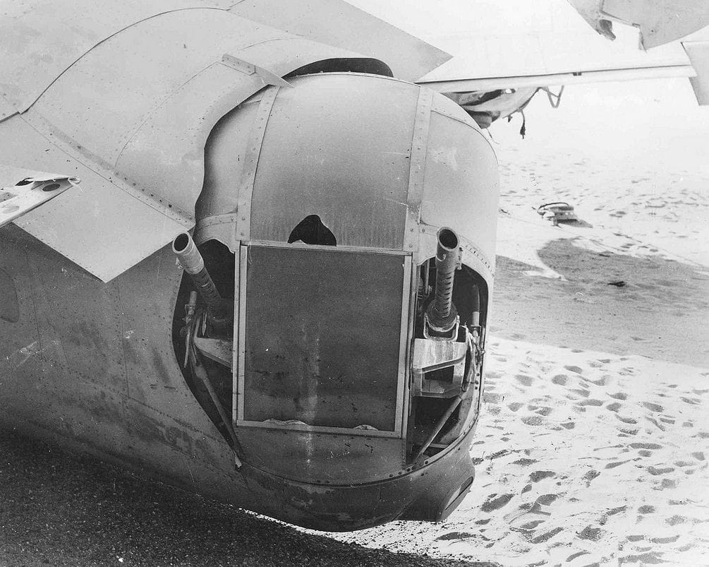 View past the tail turret of the B-24 Lady Be Good wreck in the desert