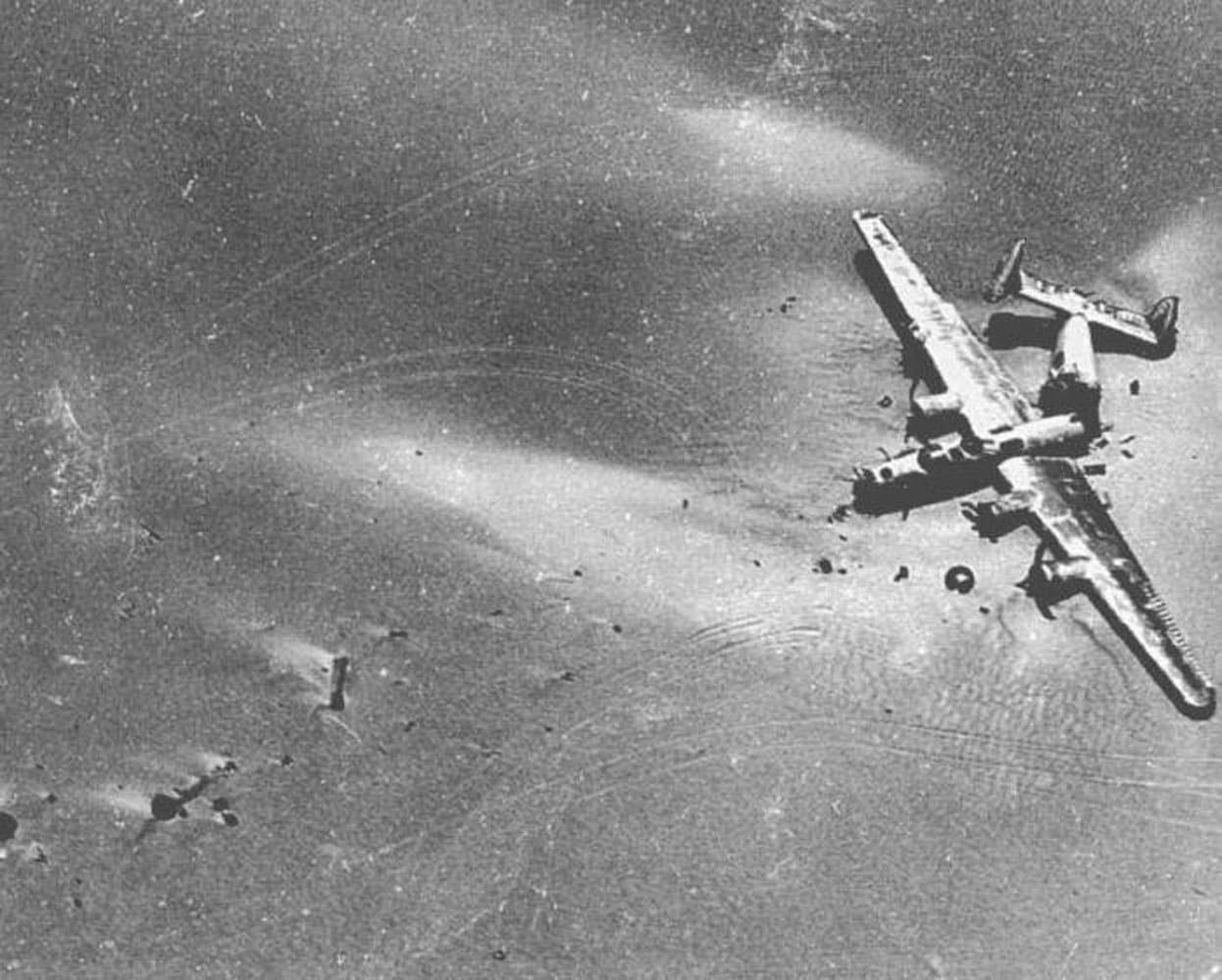 Wreckage of the B-24D Lady Be Good lying broken in two in the Libyan desert