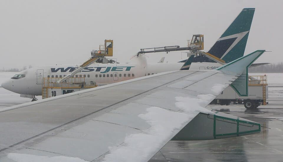 Aircraft being de-iced at Ottawa airport in winter