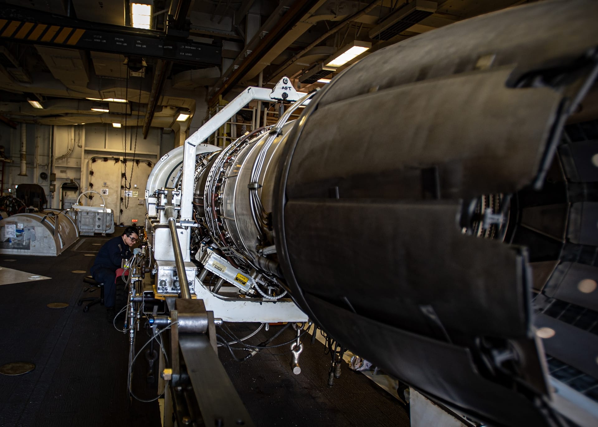 Aircraft maintenance engineer working on a jet engine