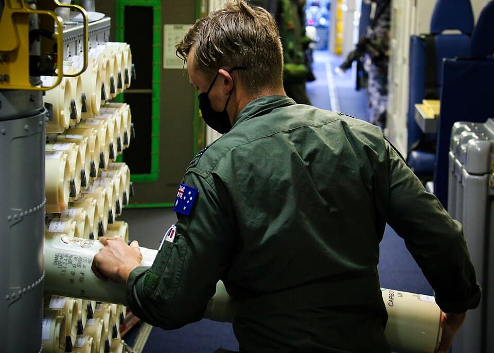 RAAF crew loads sonobuoys on a P-8A Poseidon