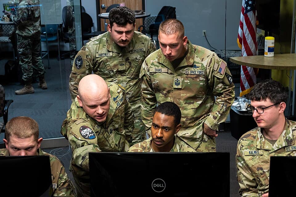 Space Force Guardians work on a satellite