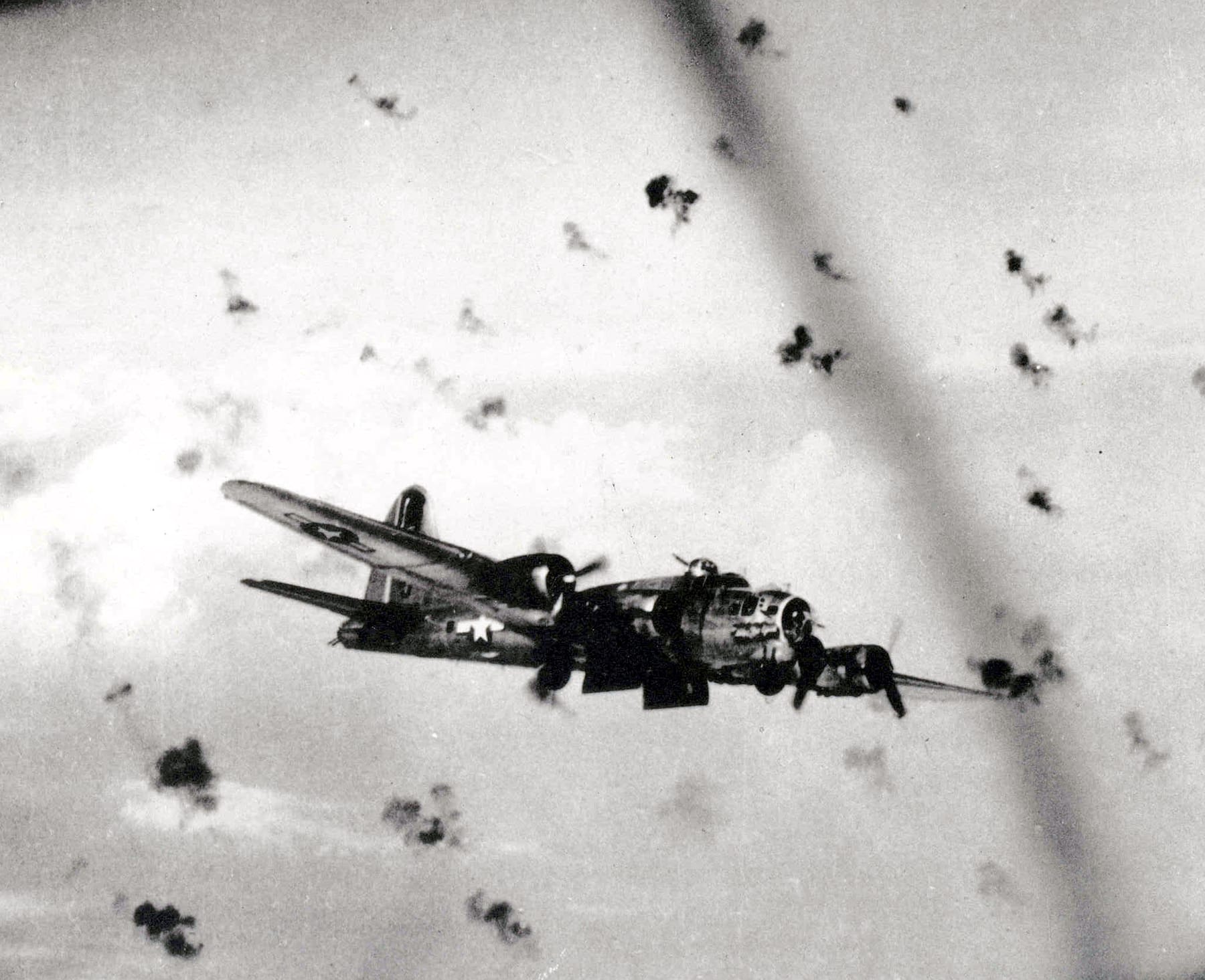 B-17 Flying Fortresses flying through heavy flak on a bombing run over Europe