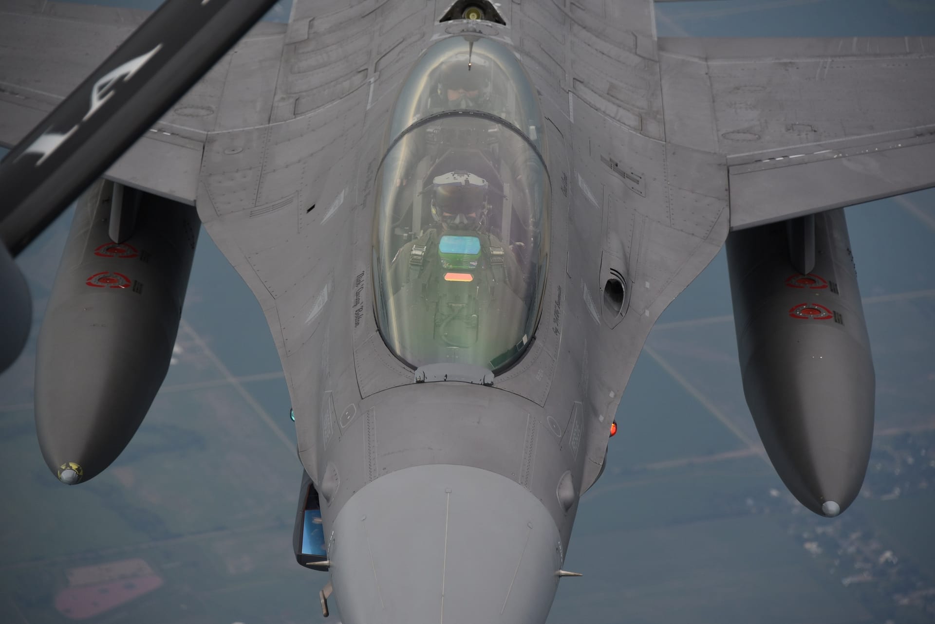 F-16 flying behind the boom of a KC-135 Stratotanker