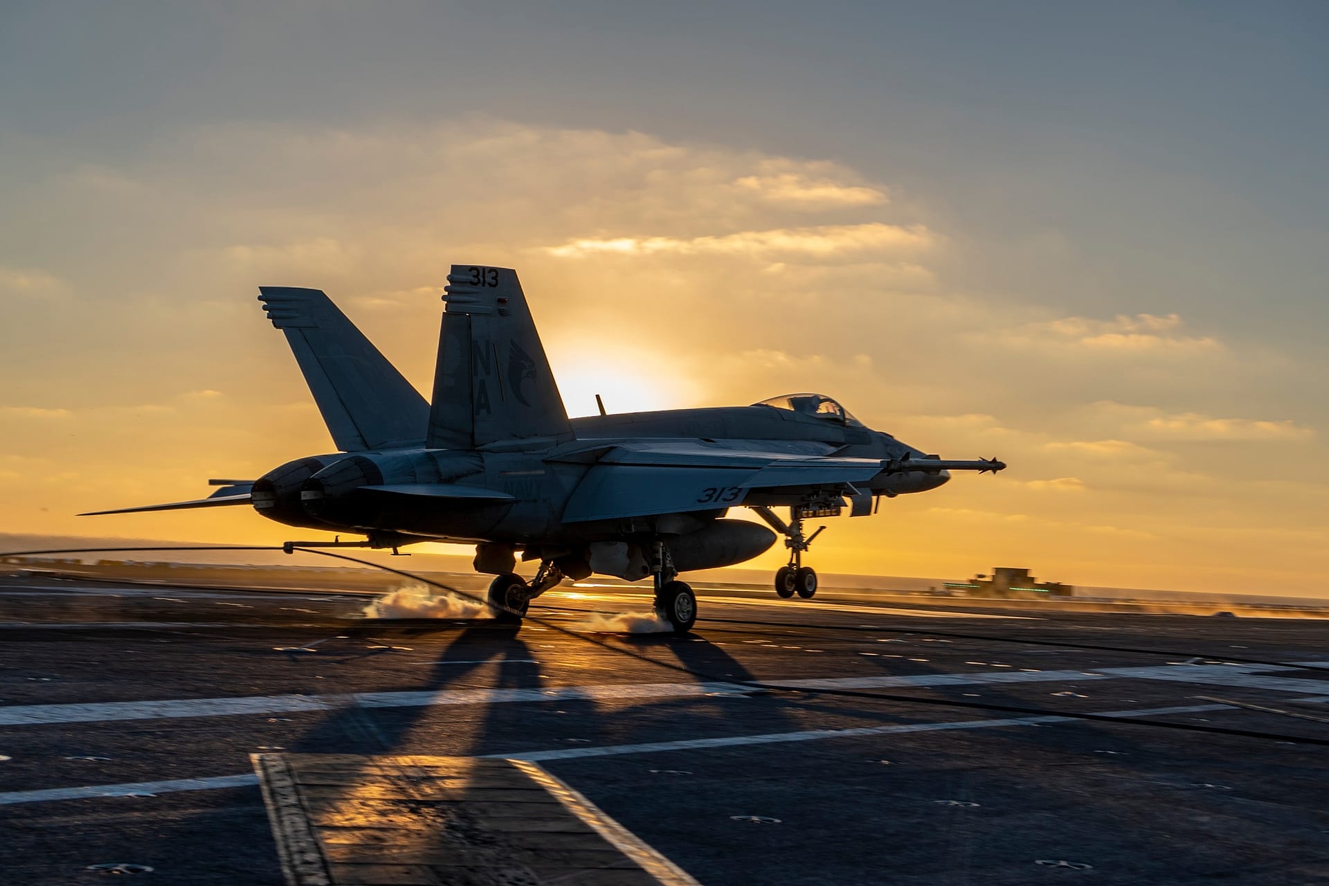 An F/A-18 makes an arrested landing aboard USS Nimitz