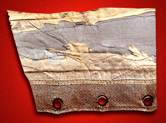 Torn fabric on the tail fin of the Graf Zeppelin after its first transatlantic crossing in 1928