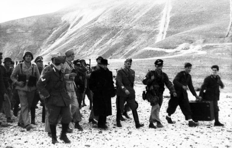 Mussolini leaves the Hotel Campo Imperatore with German paratroopers, 12 September 1943