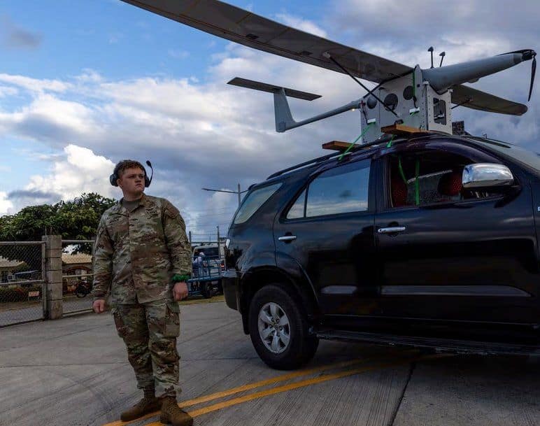 A soldier checks a Kraus Hamdani K1000 solar-powered drone in the Philippines