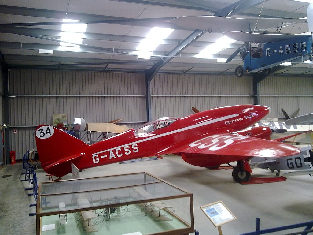 The red de Havilland DH.88 Comet racer in flight