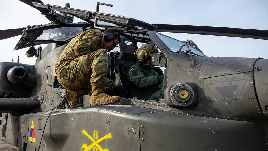 Polish air crews and maintainers with a U.S. Army AH-64 Apache in Poland