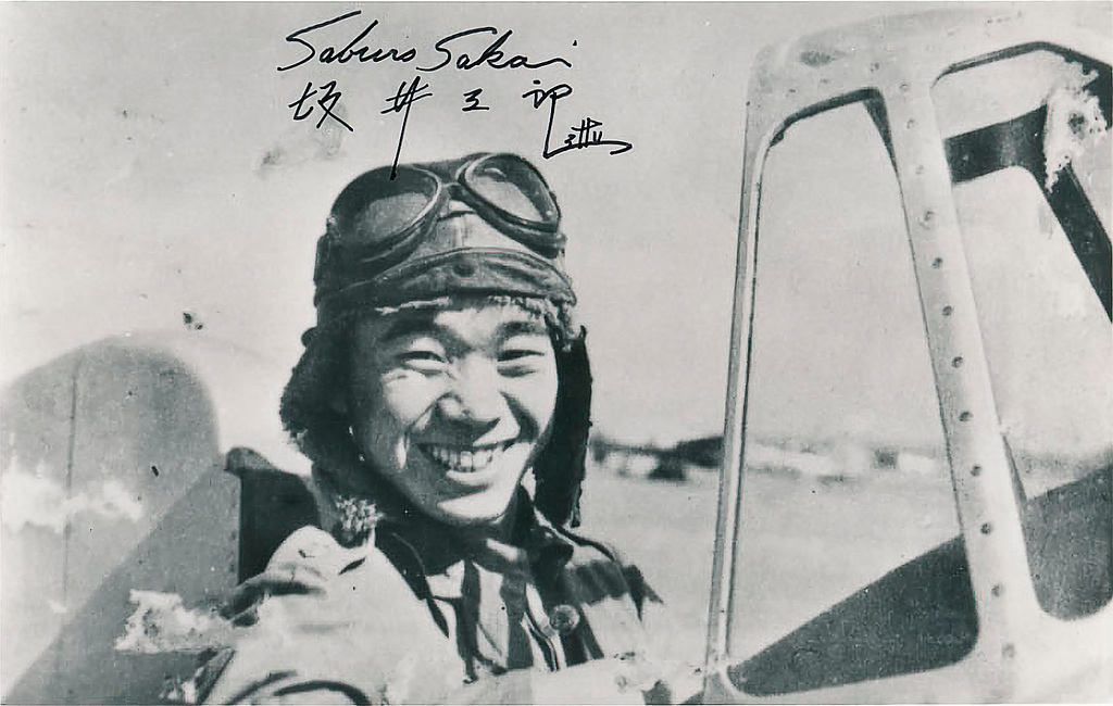 Japanese naval aviator Saburo Sakai standing with a Mitsubishi A5M fighter in 1939