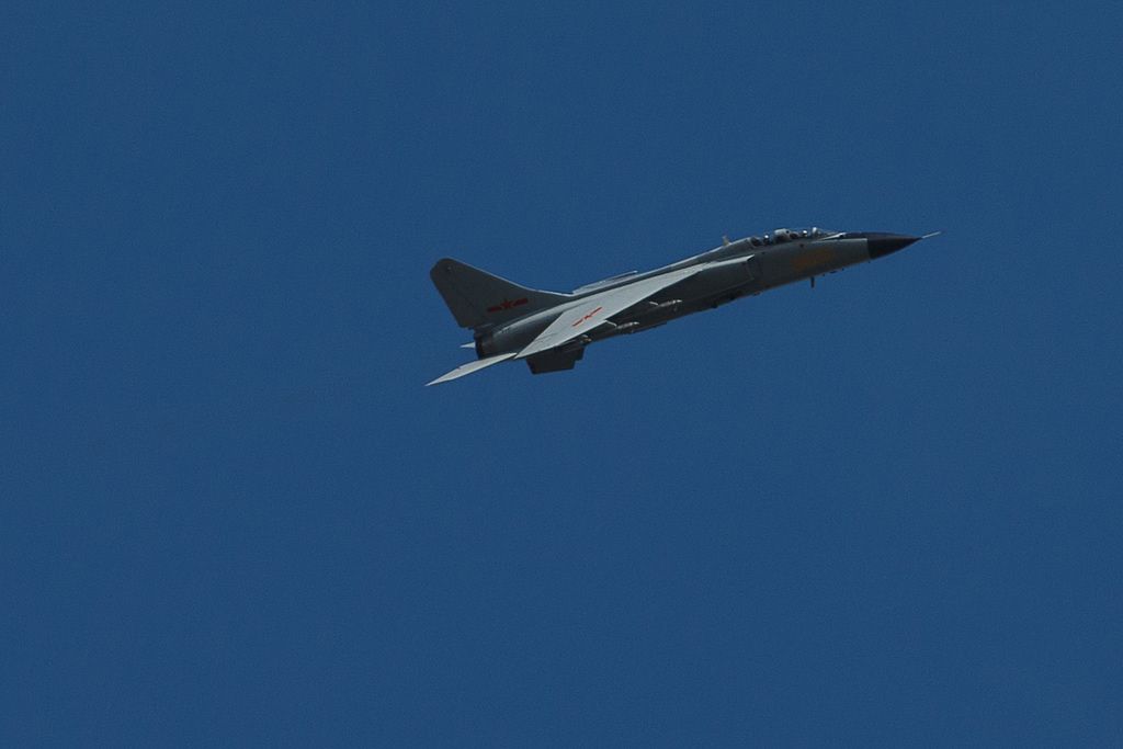 A JH-7A climbing against a clear sky during the Vostok 2018 exercise.