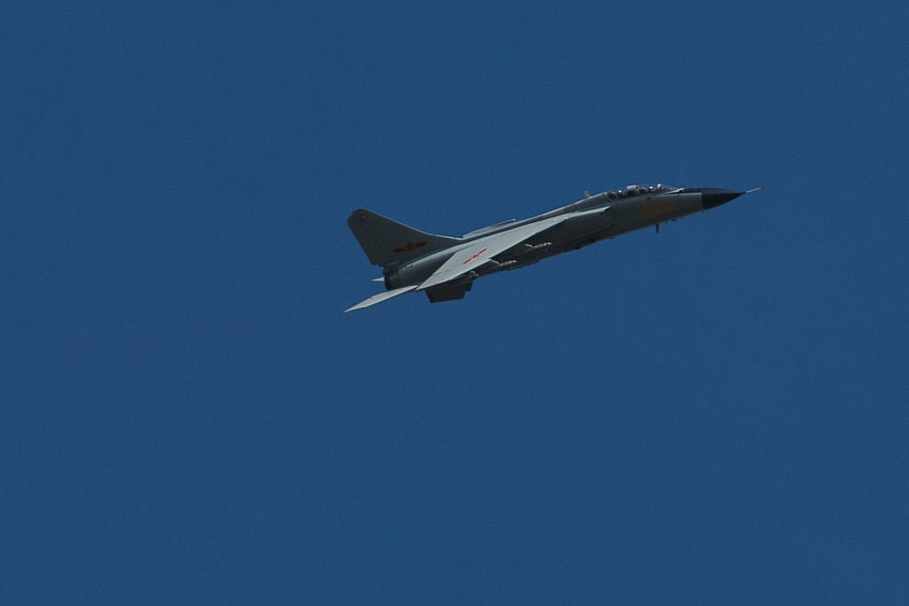 A JH-7A climbing against a clear sky during the Vostok 2018 exercise.