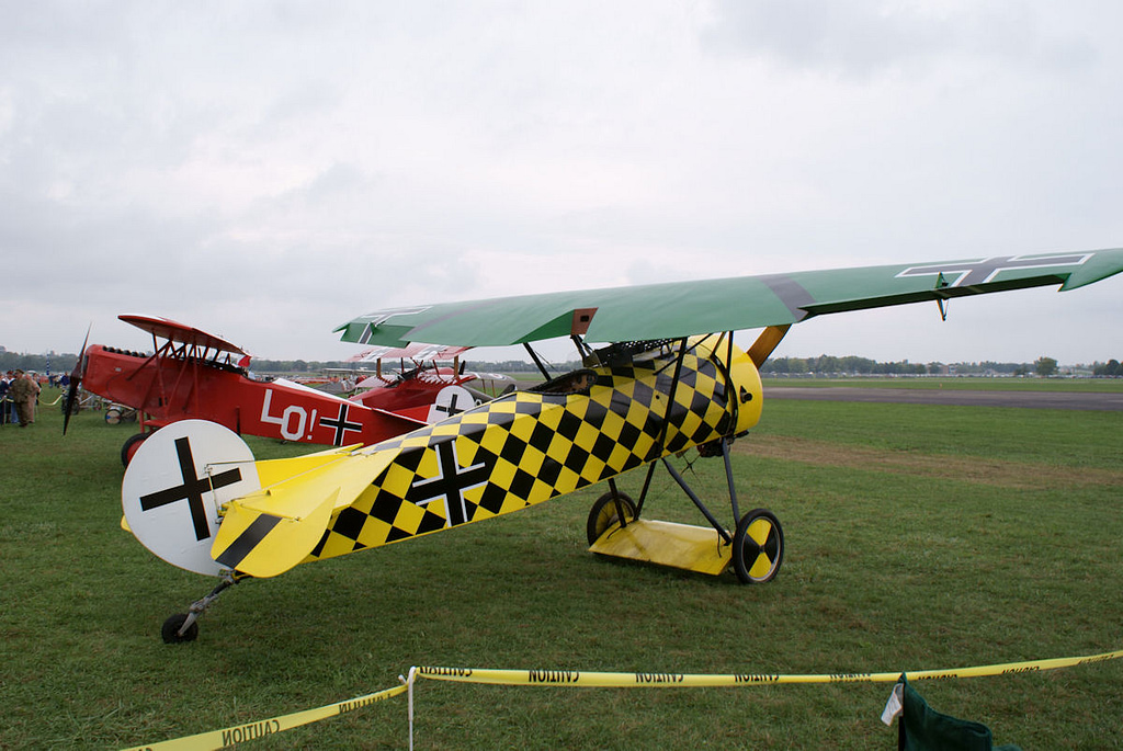 A D.VIII (front) displayed with a Fokker D.VII and a Dr.I triplane — three generations of