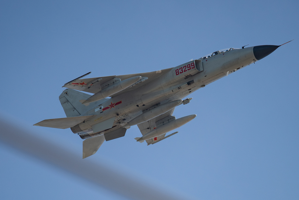 A Xian JH-7 Flying Leopard banking in flight with external stores the aircraft in its element.