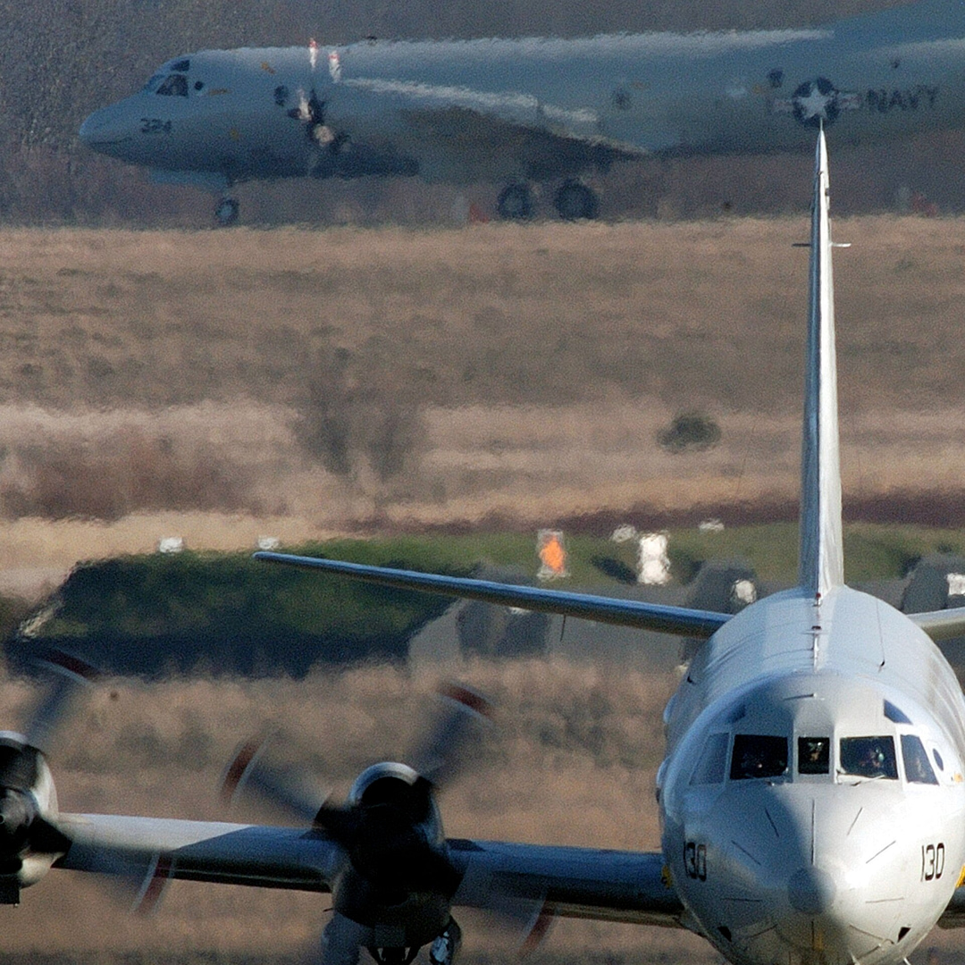 Two U.S. Navy Lockheed P-3 Orion aircraft flying in formation
