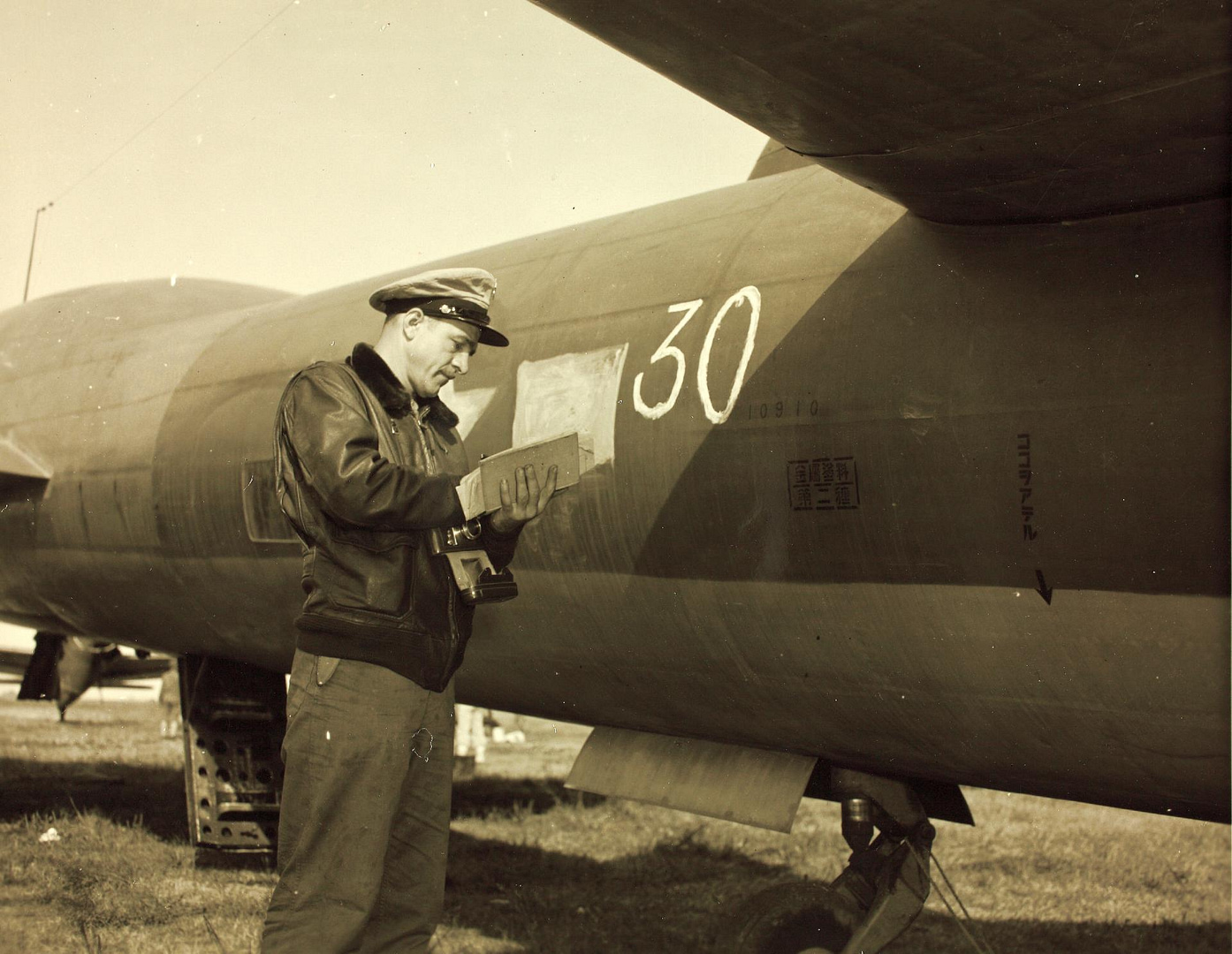 United States airman inspecting a captured Mitsubishi Ki-67 bomber