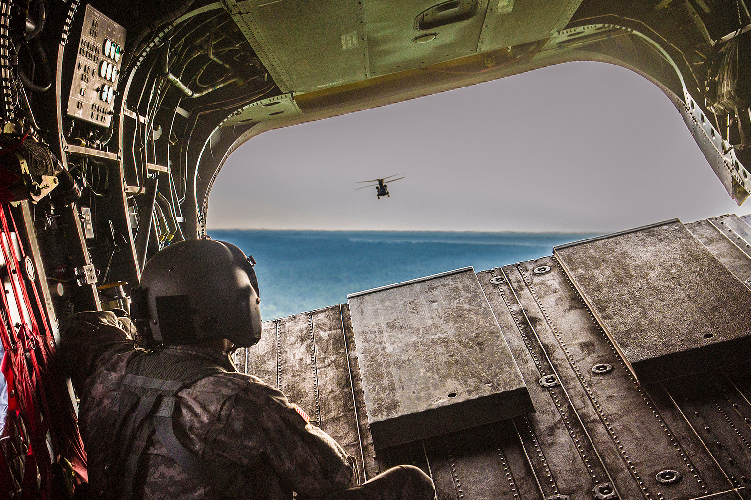 Flight engineer on the rear ramp of a CH-47F Chinook